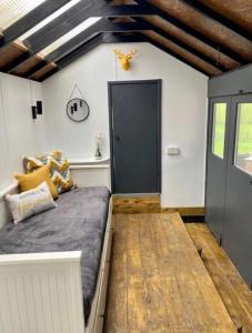 a room with a bed and a black door at Moon Valley Glamping 