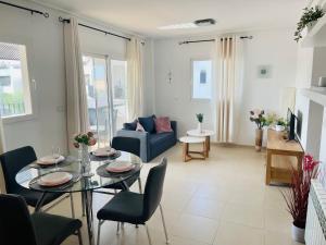 a living room with a table and a couch at Apartment Lucy Hacienda Riquelme Golf resort in Murcia