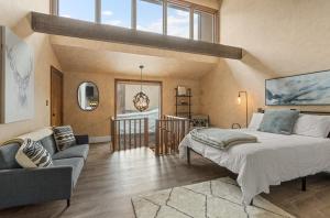 a bedroom with a large bed and a living room at Tamarron Lodge 752 & 753 in Durango +34 photos