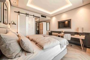 TV a/nebo společenská místnost v ubytování Fasson Hotel