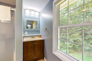 a bathroom with a sink and a large window at RiverHouse in Ogunquit +118 photos