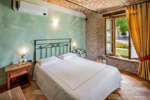 Postel nebo postele na pokoji v ubytování Relais Montemarino