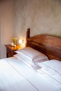 Postel nebo postele na pokoji v ubytování Relais Montemarino