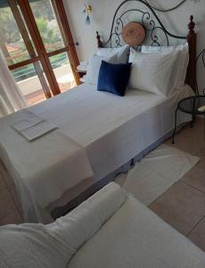 A bed or beds in a room at Yades elegant villa 2 minutes away from the beach
