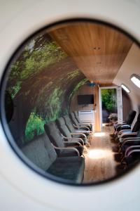 a view of a train with chairs in a tunnel at WYDMA Resort Medi & SPA - Normobaria in Mrzeżyno