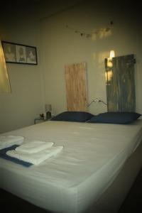 A bed or beds in a room at Seaside resort- kallithea