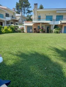 A garden outside Yades elegant villa 2 minutes away from the beach