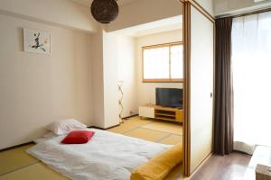 Postel nebo postele na pokoji v ubytování B201/大阪人气景点黑门市场步行6分钟，日本桥、难波、心斋桥、道顿堀步行可达