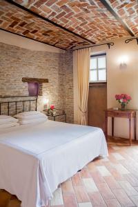 Postel nebo postele na pokoji v ubytování Relais Montemarino + 37 fotografií