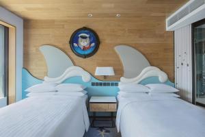 Voodi või voodid majutusasutuse Hong Kong Ocean Park Marriott Hotel toas