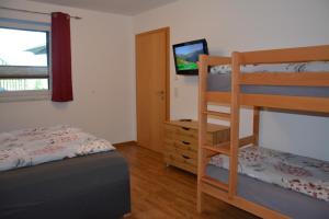 A bed or beds in a room at Appartement Wieshof