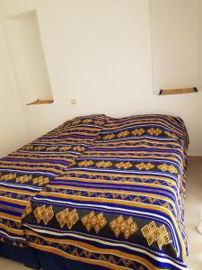 Tempat tidur dalam kamar di TAFOULT Village