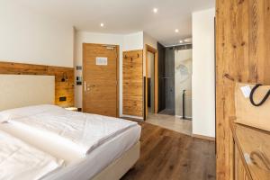 Postel nebo postele na pokoji v ubytování Active Alm Hotel + 20 fotografií