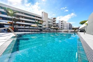 a large swimming pool in front of a building at Labranda Suites Costa Adeje in Adeje