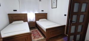 Ένα ή περισσότερα κρεβάτια σε δωμάτιο στο Hazmurat Hotel