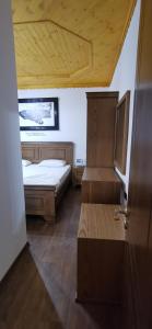 Ένα ή περισσότερα κρεβάτια σε δωμάτιο στο Hazmurat Hotel