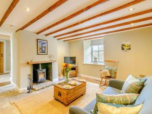 a living room with a couch and a fireplace at Martin's Farm House in Richmond