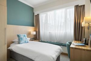 Cama ou camas em um quarto em Esplanade Hotel