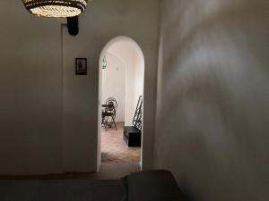 a hallway with an archway and a dining room at Casa Carmela in Ponza