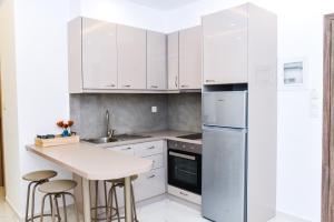 Kuchyň nebo kuchyňský kout v ubytování La Perla Apartments