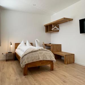 Postel nebo postele na pokoji v ubytování Hotel Rätia
