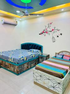 two beds sitting next to each other in a room at Smart Stays in Gorakhpur +80 photos