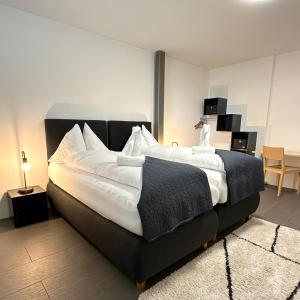 Postel nebo postele na pokoji v ubytování Hotel Rätia
