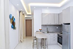 Kuchyň nebo kuchyňský kout v ubytování La Perla Apartments