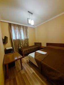 Postel nebo postele na pokoji v ubytování Piano Hotel