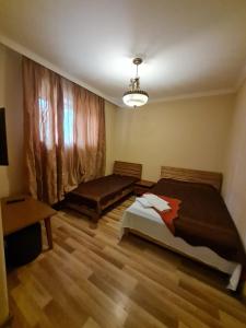 Postel nebo postele na pokoji v ubytování Piano Hotel