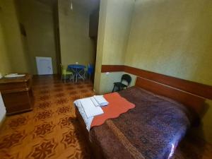 Postel nebo postele na pokoji v ubytování Piano Hotel