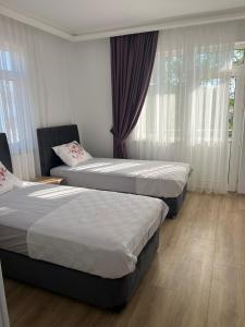 Postel nebo postele na pokoji v ubytování Asimado Hotel