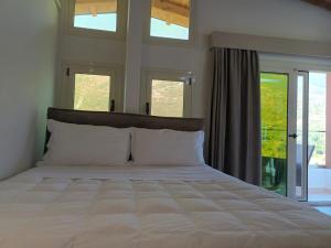 Postel nebo postele na pokoji v ubytování Hotel Relax Dhermi
