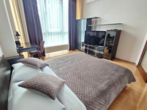 Ένα ή περισσότερα κρεβάτια σε δωμάτιο στο Vodogray apartments