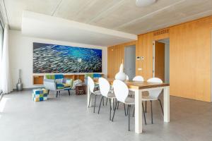 a dining room with a table and chairs at Villa Mar in Can Picafort