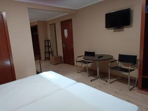 A television and/or entertainment centre at Cruceiro do Monte