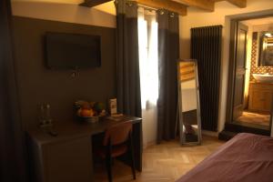 A bed or beds in a room at Hotel Dal Menga