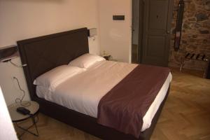 A bed or beds in a room at Hotel Dal Menga