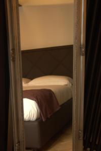 A bed or beds in a room at Hotel Dal Menga