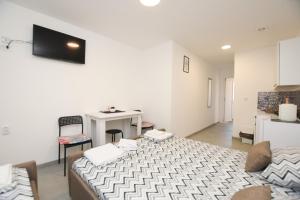 TV o dispositivi per l'intrattenimento presso Olymp Apartmani