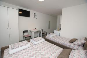 Letto o letti in una camera di Olymp Apartmani