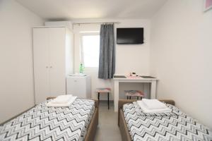 Letto o letti in una camera di Olymp Apartmani