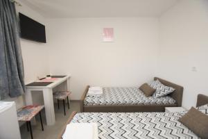TV o dispositivi per l'intrattenimento presso Olymp Apartmani