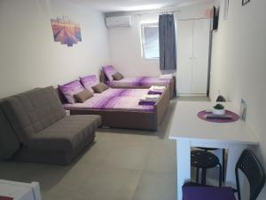 Area soggiorno di Olymp Apartmani