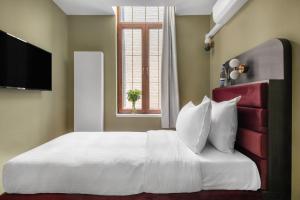 Cama o camas de una habitación en numa I Scoop Rooms & Apartments