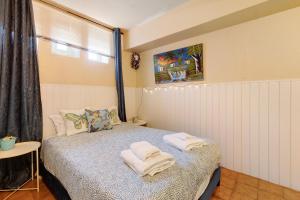 Кровать или кровати в номере Soares Beach Apartment