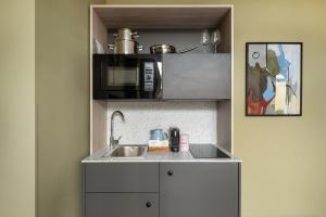Кухня или кухненски бокс в numa I Scoop Rooms & Apartments