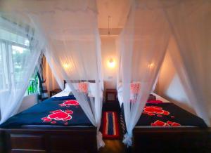 Postel nebo postele na pokoji v ubytování The Bliss Homestay