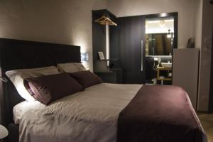 A bed or beds in a room at Hotel Dal Menga