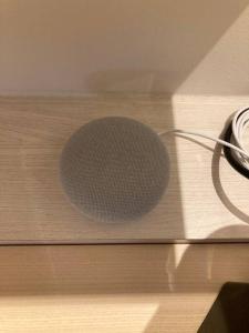 a microphone sitting on top of a wooden table at Studio cosy Cours Mirabeau au cœur d'Aix-en-Provence in Aix-en-Provence